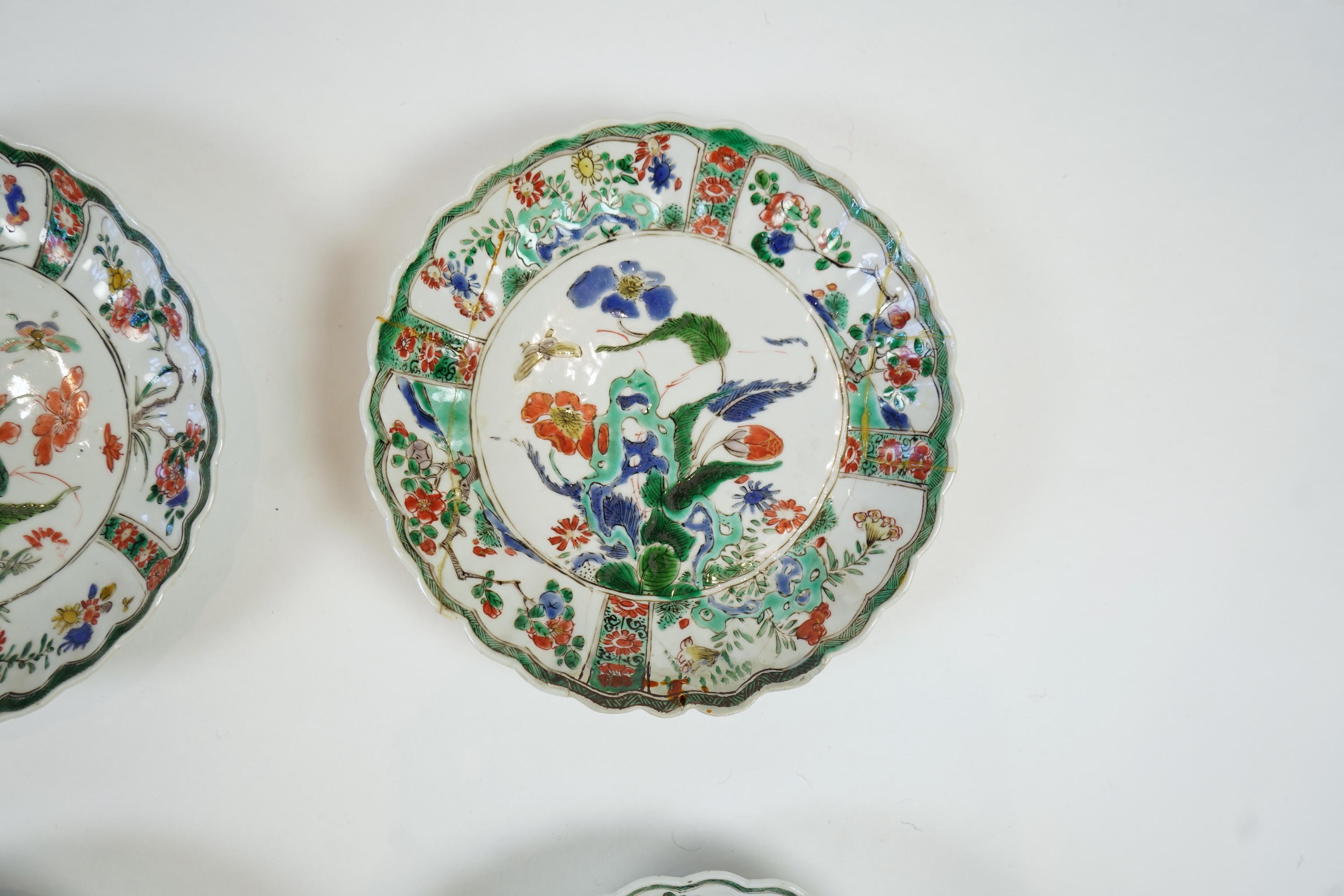 A set of six Chinese famille verte petal lobed saucer dishes, Kangxi period